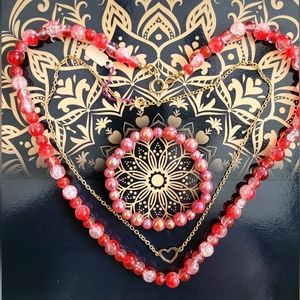 Red necklace, bracelet and gold heart necklace